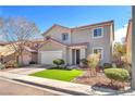Charming home with a red tiled roof, a manicured lawn, a two-car garage and a welcoming entrance at 11160 Romola St, Las Vegas, NV 89141