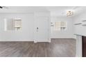 Bright living room with wood-look flooring, and white walls at 12367 Indigo Montage Rd # 3, Las Vegas, NV 89183