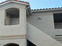 A close exterior view of the building with its private balcony, showing the unit number at 1881 W Alexander Rd # 2095, North Las Vegas, NV 89032