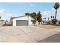 Single story home with a gray two car garage, concrete driveway and low maintenance front yard at 2236 E Hacienda Ave, Las Vegas, NV 89119