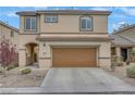 A charming two-story home boasting a neutral-toned exterior, well-maintained landscaping, and a two-car garage at 2445 Rue Royale, Henderson, NV 89044