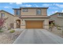 A two-story home boasting neutral-toned exterior, well-maintained landscaping, and a spacious two-car garage at 2445 Rue Royale, Henderson, NV 89044