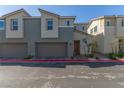 Contemporary two-story house with a two-car garage, drought tolerant landscaping, and modern color palette at 2901 Bahama Yellow Ave, North Las Vegas, NV 89086