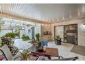 Enclosed patio area featuring tiled flooring, textured walls, tasteful décor, and outdoor seating at 3053 Conquista Ct, Las Vegas, NV 89121