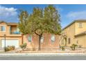 Charming two-story home featuring a well-kept lawn, tree, and two-car garage at 3525 Hammock St, Las Vegas, NV 89147