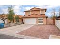 Charming two-story home boasts a spacious driveway, two-car garage, and well-kept front yard at 3744 Archer St, Las Vegas, NV 89108