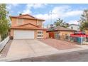 Lovely two-story home with a two-car garage and a concrete and brick paver driveway at 3744 Archer St, Las Vegas, NV 89108