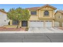 Charming two-story home featuring a two-car garage, desert landscaping, and stucco exterior at 4416 Dunlap Crossing St, Las Vegas, NV 89129
