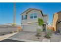 Charming home with a two-car garage, tidy landscaping, and a well-maintained front yard at 5691 Tinar St, Las Vegas, NV 89113