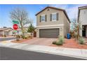 Attractive two-story home with desert landscaping, a brown two-car garage, and a well-kept front yard at 6619 Frosted Harvest Ave, Las Vegas, NV 89108