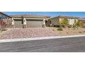 Lovely single-story home featuring a three-car garage and appealing desert landscaping at 10062 Mountain Foothills Ave, Las Vegas, NV 89149