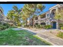 Apartment complex with lush landscaping, mature trees, and well-maintained grounds at 10245 S Maryland Pkwy # 255, Las Vegas, NV 89183