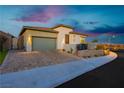 Charming single-story home featuring desert landscaping, brick driveway, and side gate at 11700 Belorado Ave, Las Vegas, NV 89138