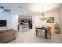 Spacious living room and dining area with a view of the kitchen at 1187 Kiamichi Ct, Henderson, NV 89002