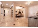 Open hallway with archways leading to dining room and other living spaces at 1313 Gallery Oaks Dr, Las Vegas, NV 89123