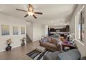 Bright living room with neutral walls, stylish furniture, and open access to the kitchen at 168 Springhouse St, Las Vegas, NV 89148