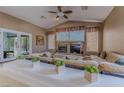 Comfortable living room features a fireplace and view to the outdoor patio at 1720 Sand Storm Ct, Henderson, NV 89074