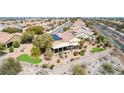 Backyard featuring a covered patio, garden area, manicured lawn, and artificial turf in a residential neighborhood at 2971 Fort Matanzas Ter, Henderson, NV 89052