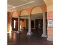 Elegant building entrance featuring tiled floors, columns, and signage for Viera Private Residences at 30 Strada Di Villaggio # 439, Henderson, NV 89011