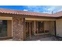 Home exterior featuring a decorative security gate leading into the enclosed front patio at 3407 Bristlecone St, Las Vegas, NV 89146