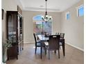 Cozy dining room boasts natural light and elegant furnishings, perfect for entertaining at 3925 Kettle Falls Ave, North Las Vegas, NV 89085