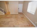 Open living room featuring tile floors, stairway, and natural light at 41 Rosa Rosales Ct, North Las Vegas, NV 89031