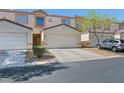Well-maintained townhome featuring a private front entrance and an attached one-car garage at 5330 E Charleston Blvd # 116, Las Vegas, NV 89142