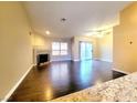 Spacious living room featuring a fireplace and sliding glass door for ample natural light at 6250 W Flamingo Rd # 11, Las Vegas, NV 89103