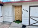 Close up of front entrance door with visible house number 6489 at 6489 Gunderson Blvd, Las Vegas, NV 89103