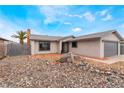 Beautiful single-story house boasting a gravel front yard and a charming exterior design, and two-car garage at 6594 Casa Linda Dr, Las Vegas, NV 89103