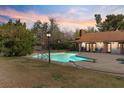 Backyard pool with diving board and plenty of patio space for outdoor relaxation at 6998 Alamitos Cir, Las Vegas, NV 89120