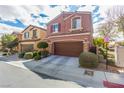 Charming two-story home featuring a well-maintained front yard with a two-car garage and inviting curb appeal at 7769 Peaceful Trellis Dr, Las Vegas, NV 89179