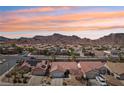 Panoramic aerial view showcases the desert neighborhood and mountains behind the home, highlighting the serene location at 1019 Amber Gate St, Henderson, NV 89002