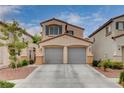 Charming two-story home featuring a spacious two-car garage and well-maintained landscaping under a sunny sky at 2431 Lilac Cove St, Las Vegas, NV 89135