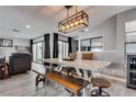 Open dining room area with a large table, a bench, and lots of natural light at 2532 Whippoorwill Ln, Las Vegas, NV 89121