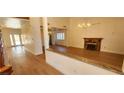 Spacious living room with hardwood floors, fireplace, chandelier, and modern design at 2916 W Oakey Blvd, Las Vegas, NV 89102