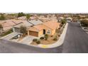 Single-story home with tile roof, complemented by xeriscape landscaping, on corner lot at 2970 Strathspey Ct, Henderson, NV 89044