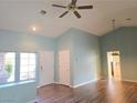 Bright living room features vaulted ceilings, wood-look floors and two entry doors for versatile living at 3117 Brightridge Dr, Las Vegas, NV 89134
