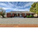 Charming brick home featuring desert landscaping and gravel driveway at 3140 Unicorn Ave, Pahrump, NV 89048