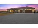 Beautiful single-story home with an attached garage and spacious driveway at 3600 E Bridger St, Pahrump, NV 89061