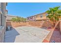 Large backyard featuring concrete, with a privacy wall and desert landscaping at 3958 Blushing Hearts Rd, Las Vegas, NV 89115