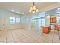 Bright and open living room with tile flooring and lots of natural light at 3958 Blushing Hearts Rd, Las Vegas, NV 89115