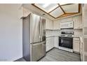 Bright kitchen features modern stainless steel refrigerator and white appliances at 4083 Nook Way # D, Las Vegas, NV 89103