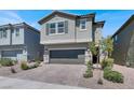 Charming two-story home with well-maintained landscaping, paver driveway, and a two-car garage at 4588 Swimming Minnow Ave, Las Vegas, NV 89141