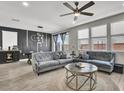 Stylish living room boasts hardwood floors, recessed lighting, and modern furniture at 4588 Swimming Minnow Ave, Las Vegas, NV 89141