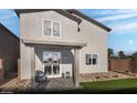 Backyard patio with an outdoor seating area with landscaping featuring artificial turf and rocks at 5180 Hisopo St # Lot 24, Las Vegas, NV 89122