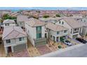 Aerial view of a neighborhood featuring modern two-story homes with desert landscaping and ample parking at 5748 Avondale Rise Way, Las Vegas, NV 89141