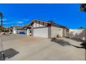 Charming single-story home with a two-car garage and a wide driveway at 6782 Bonillo Dr, Las Vegas, NV 89103