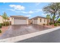 Charming single-story home with a well-manicured front yard and three car garage at 8506 River Ridge Dr, Las Vegas, NV 89131