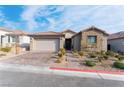 Charming single-story home featuring a well-manicured front yard, desert landscaping, and brick paved driveway at 8648 Cloverbelle St, Las Vegas, NV 89166